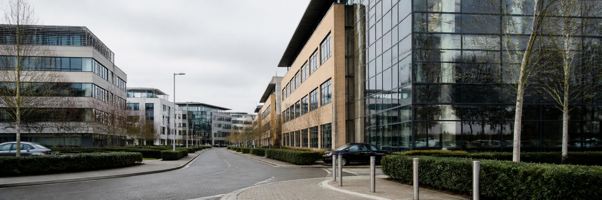 A contemporary UK commercial office district in soft daylight